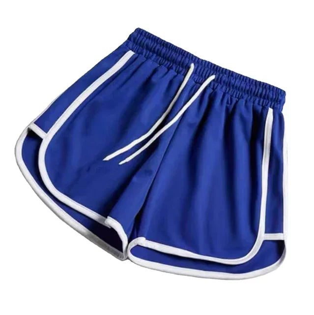 Shorts femininos de verão soltos e elásticos, modelo usado em pose de lazer ao ar livre